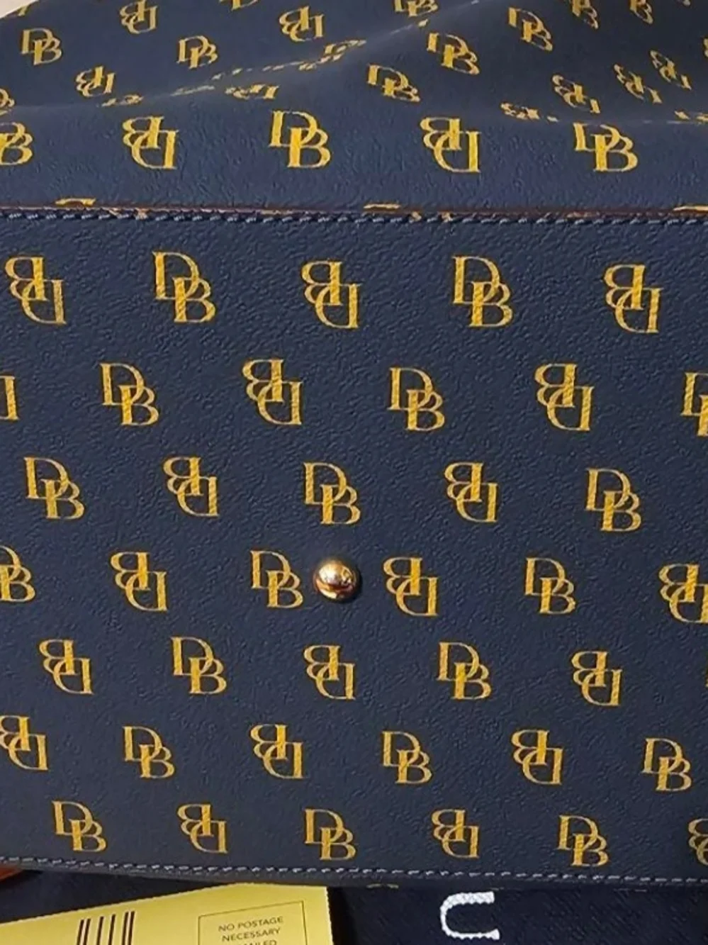 Pre-owned. Price Is Firm -Dooney & Bourke Navy and Gold Signature Tote